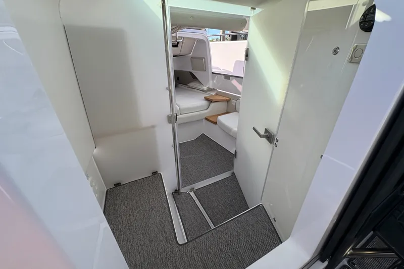 Slide: The Image of Interior view of 2026 Axopar 37 XC Cross Cabin, featuring modern design and compact layout. - 43