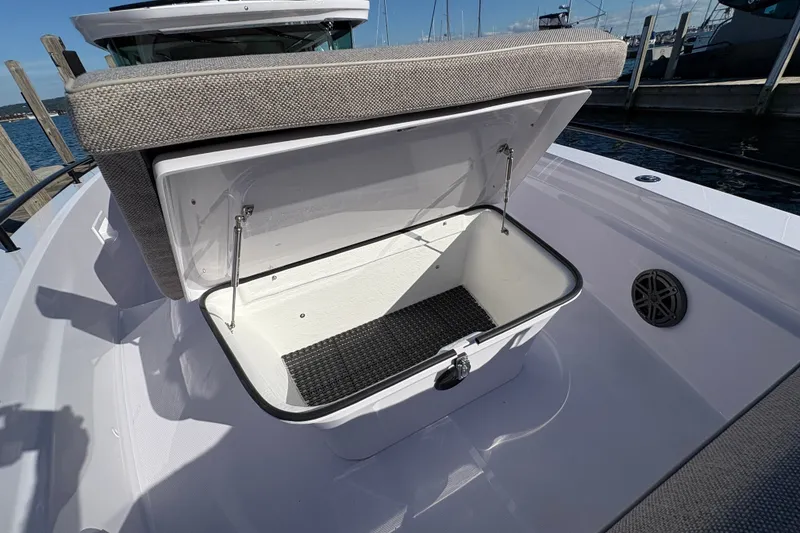 Slide: The Image of Open storage compartment on 2026 Axopar 37 XC Cross Cabin boat deck. - 27
