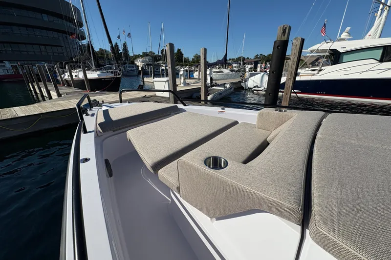 Slide: The Image of 2026 Axopar 37 XC Cross Cabin at marina, featuring spacious sunbathing area. - 24