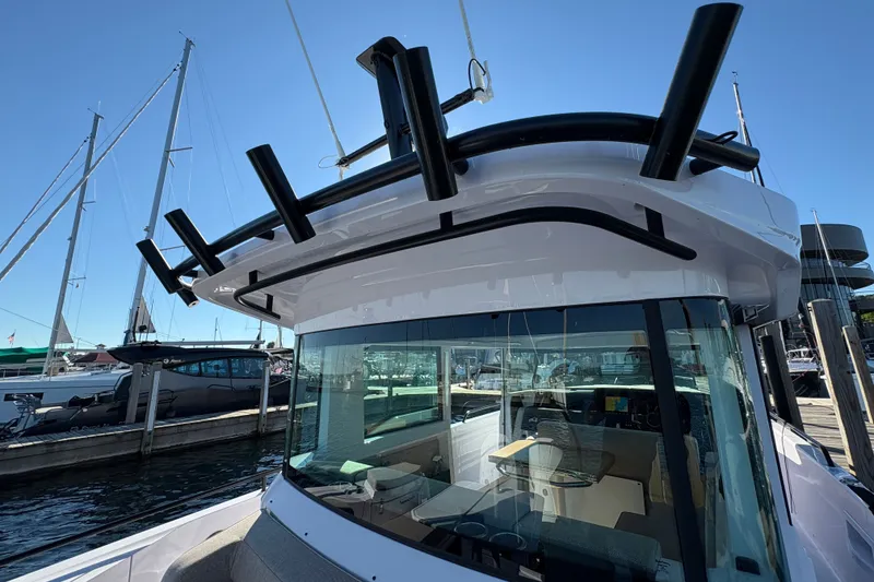 Slide: The Image of 2026 Axopar 37 XC Cross Cabin boat docked at marina, showcasing sleek design and modern features. - 15