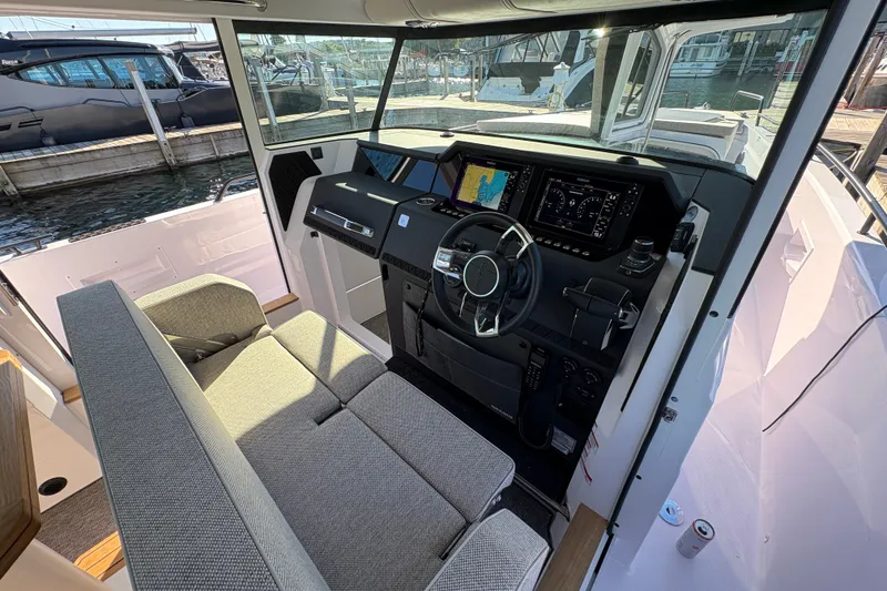 Slide: The Image of Interior of 2026 Axopar 37 XC Cross Cabin with modern dashboard and seating. - 35