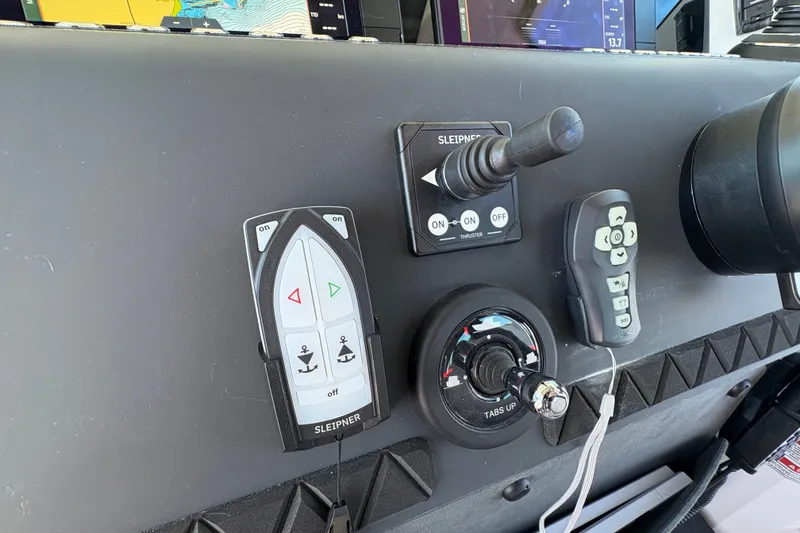 Slide: The Image of Control panel of 2026 Axopar 37 XC Cross Cabin with navigation and joystick controls. - 38