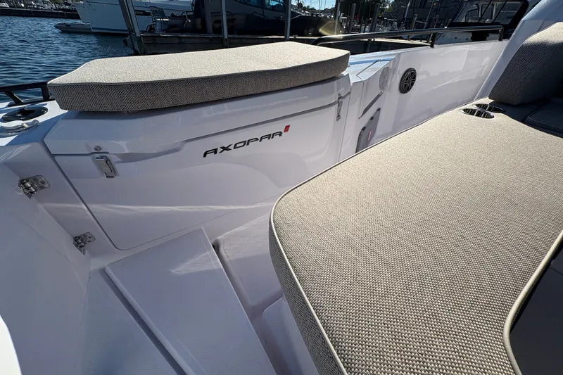 Slide: The Image of 2026 Axopar 37 XC Cross Cabin boat interior with cushioned seating and sleek design. - 18