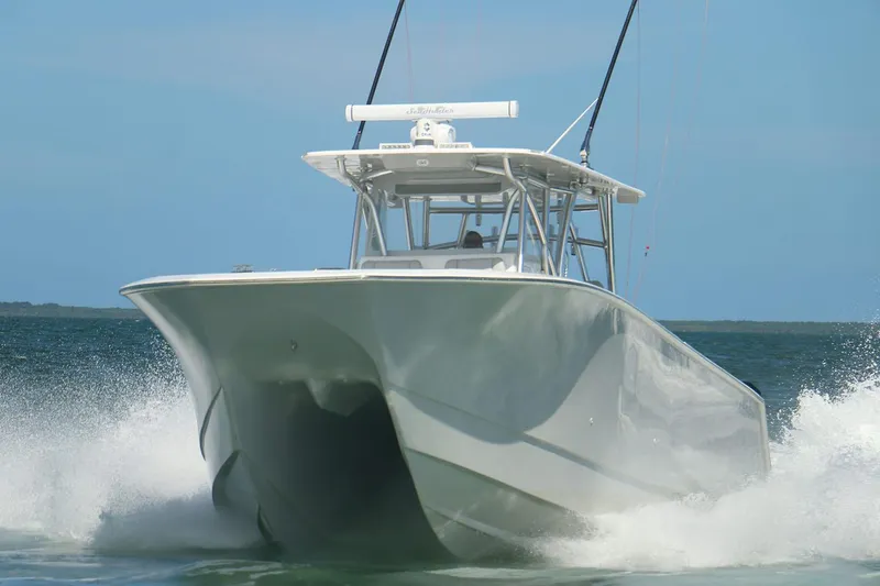 Slide: The Image of Manufacturer Provided Image: 2025 SeaHunter 41 CTS boat cruising on open water. - 2