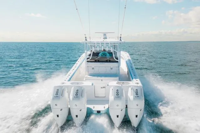 Slide: The Image of Manufacturer Provided Image: 2026 SeaHunter 41 CTS boat cruising on open water with four powerful engines. - 3