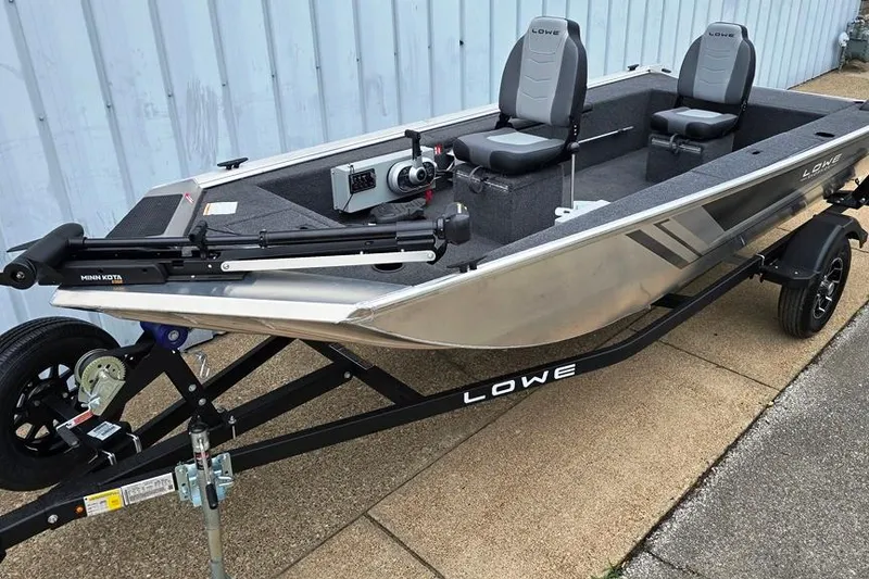 The Image of 2026 Lowe Skorpion SS fishing boat on trailer, featuring dual seats and Minn Kota trolling motor. - 0