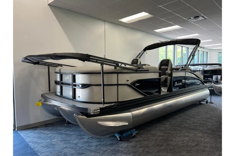 The Image of 2025 Barletta Cabrio 22UC pontoon boat displayed indoors, featuring sleek design and modern amenities. - 0
