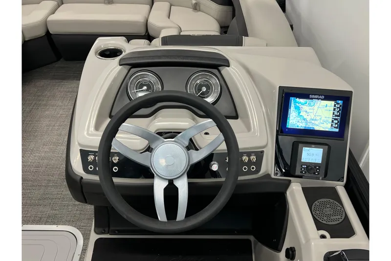 Slide: The Image of 2025 Barletta Cabrio 22UC boat dashboard with steering wheel and navigation display. - 11