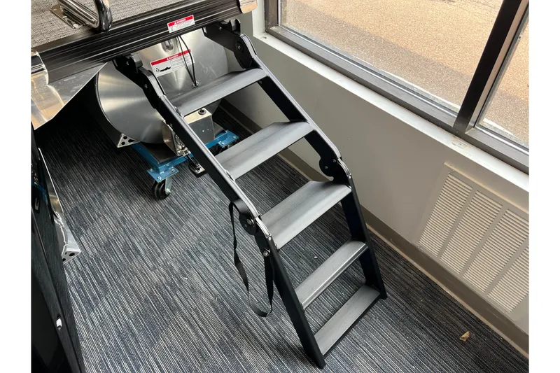 Slide: The Image of Sturdy black ladder on Barletta Cabrio 22UC pontoon boat, 2025 model. - 3