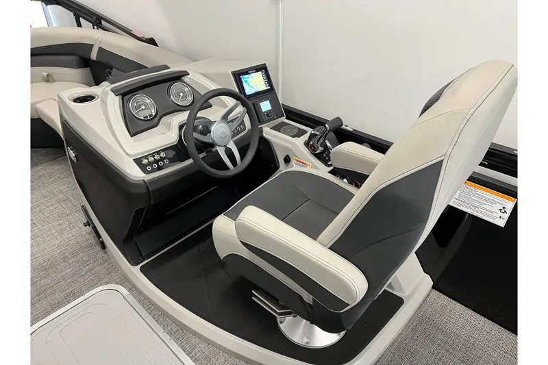 Slide: The Image of 2025 Barletta Cabrio 22UC boat interior with modern helm and comfortable captain's chair. - 8