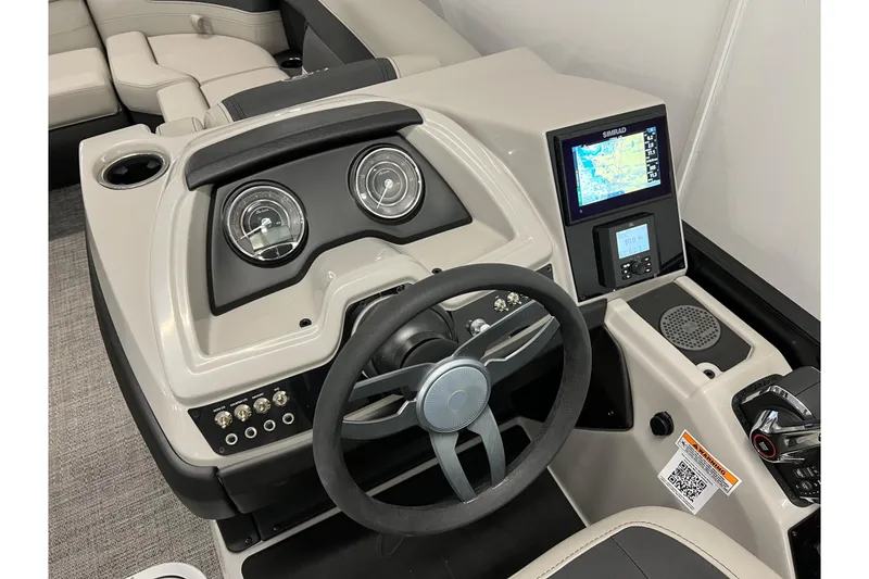 Slide: The Image of 2025 Barletta Cabrio 22UC boat dashboard with steering wheel and navigation display. - 9