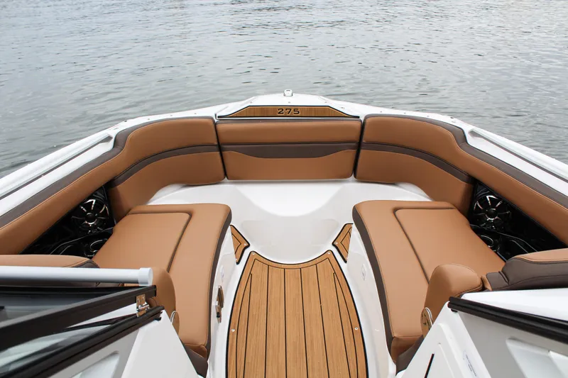 Slide: The Image of 2024 Yamaha 275 SD boat interior with luxurious tan seating and sleek design. - 9