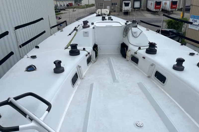 Slide: The Image of Deck view of a 1994 Nelson Marek 43 sailboat, featuring winches and rigging. - 4