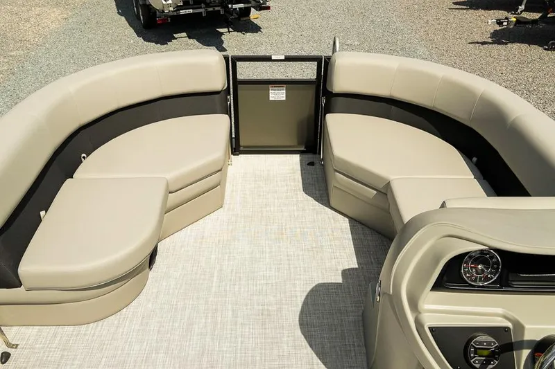 Slide: The Image of 2026 Dockside Pontoons 22DQ interior with beige seating and modern dashboard. - 12