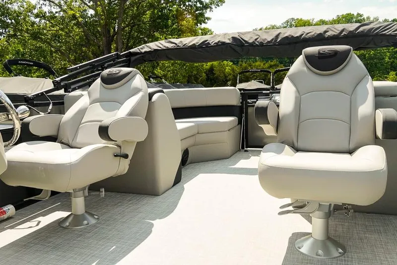 Slide: The Image of Luxury seating on 2026 Dockside Pontoons 22DQ boat, featuring plush captain chairs and sleek design. - 14