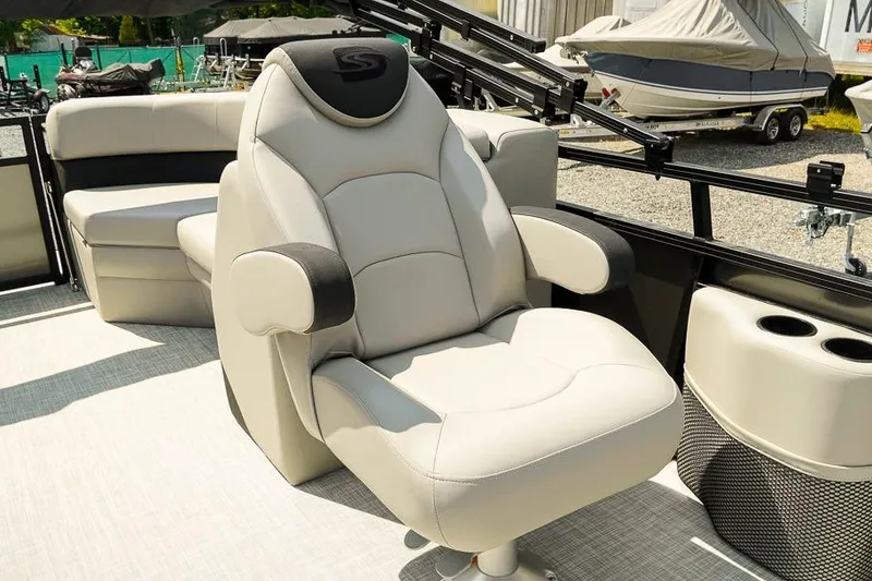 Slide: The Image of Luxurious seating on 2026 Dockside Pontoons 22DQ boat, featuring plush captain's chair. - 15