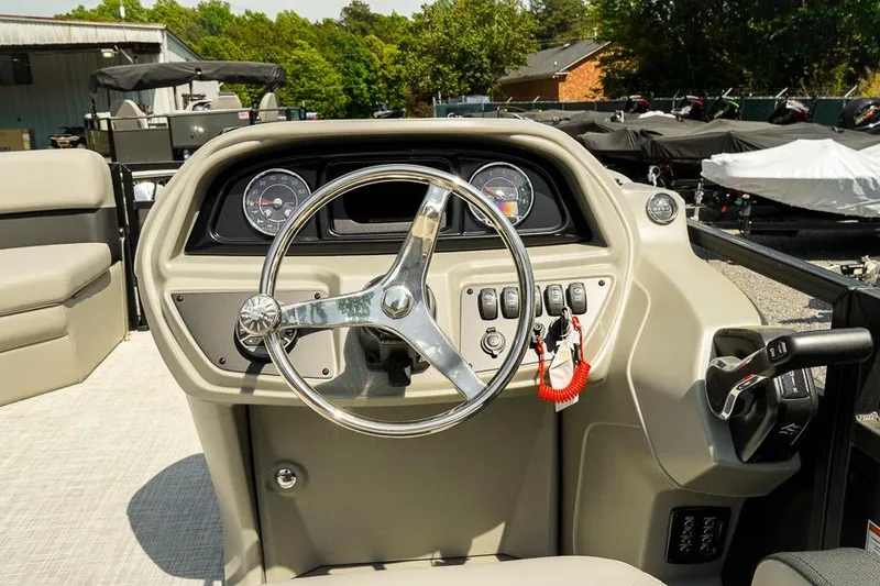 Slide: The Image of Steering console of 2026 Dockside Pontoons 22DQ, featuring modern controls and gauges. - 18