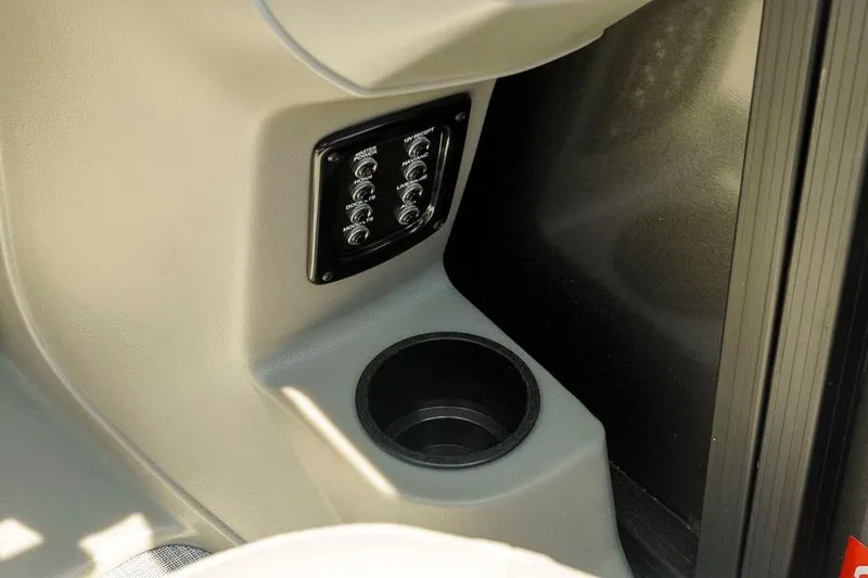 Slide: The Image of Interior of 2026 Dockside Pontoons 22DQ featuring control panel and cup holder. - 25