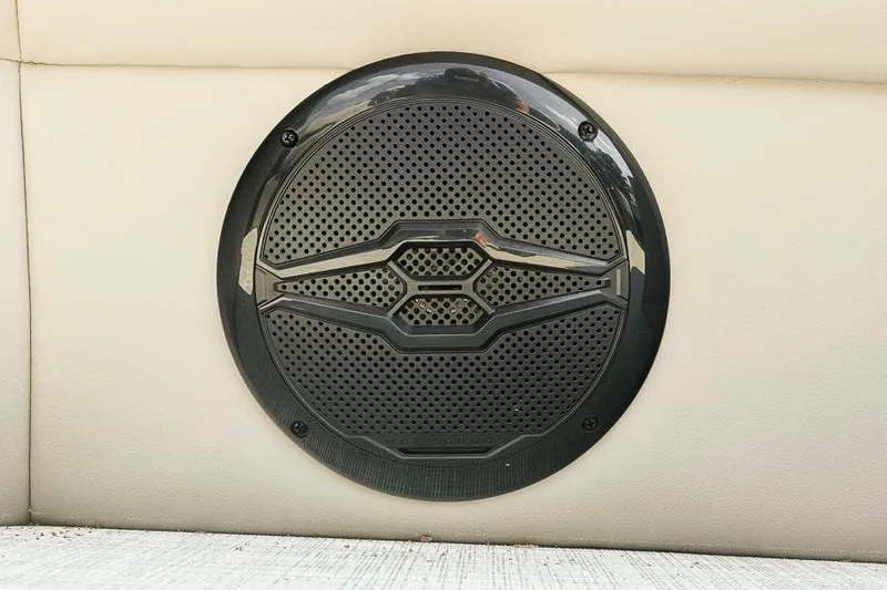 Slide: The Image of Speaker on Dockside Pontoons 22DQ, 2026 model, mounted on beige upholstery. - 28