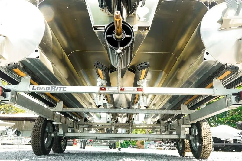Slide: The Image of 2026 Dockside Pontoons 22DQ on LoadRite trailer, showcasing undercarriage and pontoons. - 33