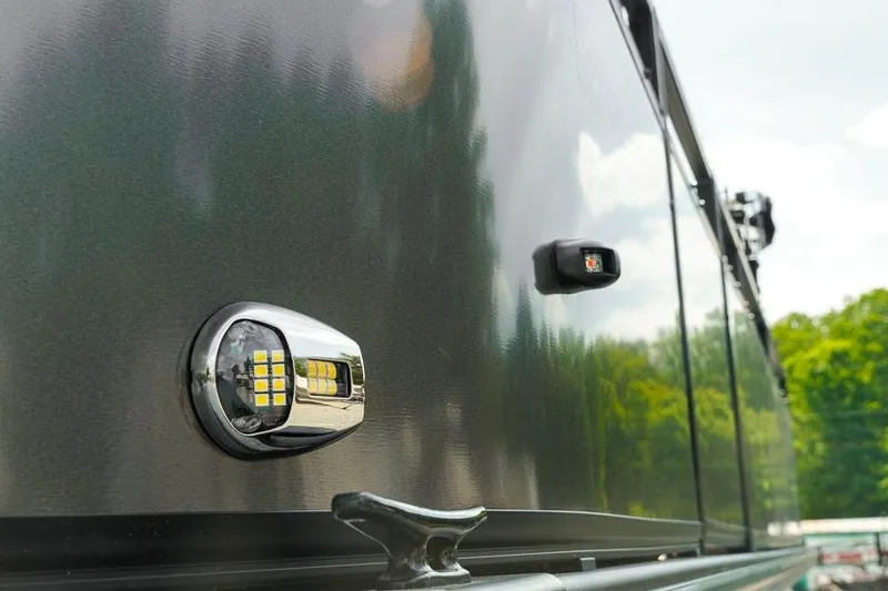Slide: The Image of Close-up of 2026 Dockside Pontoons 22DQ exterior with LED lights and cleat. - 7