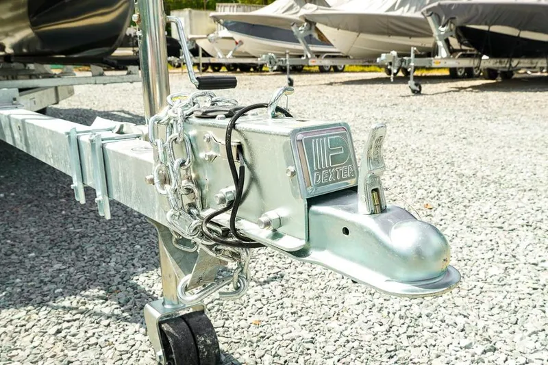 Slide: The Image of Trailer hitch of a 2026 Dockside Pontoons 22DQ on gravel lot. - 9