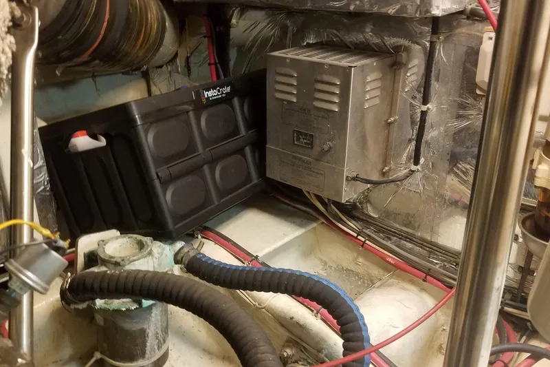 Slide: The Image of Engine room of a 1993 Novatec 44 boat with electrical components and wiring. - 20