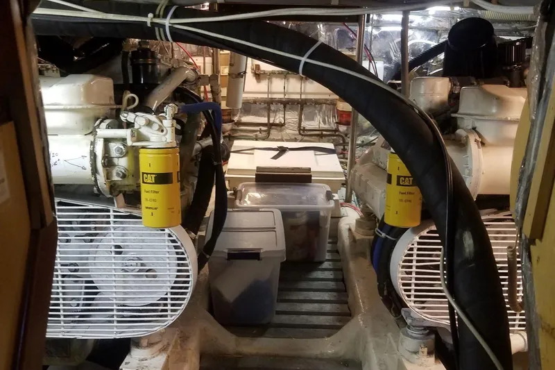 Slide: The Image of Engine room of a 1993 Novatec 44 yacht, featuring dual CAT fuel filters. - 21