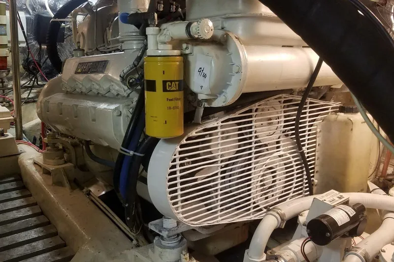 Slide: The Image of Engine room featuring a 1993 Novatec 44 engine with CAT fuel filter. - 22