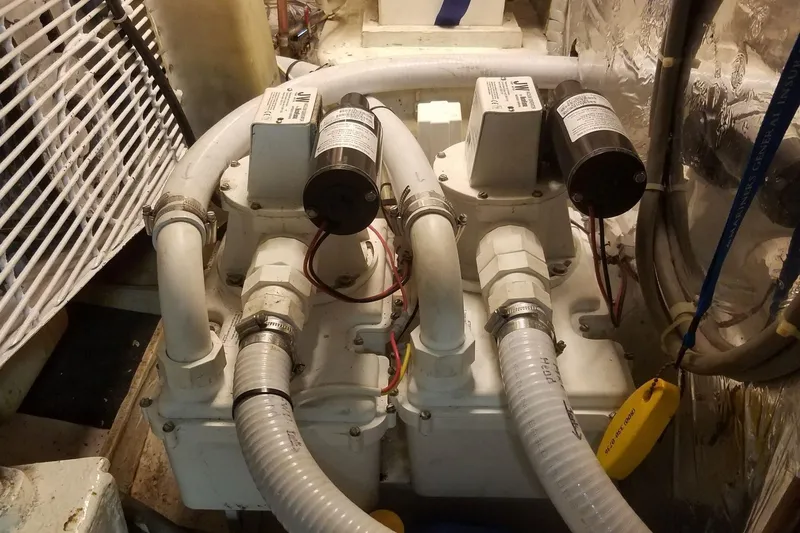Slide: The Image of Engine room of 1993 Novatec 44 with dual pumps and hoses. - 24