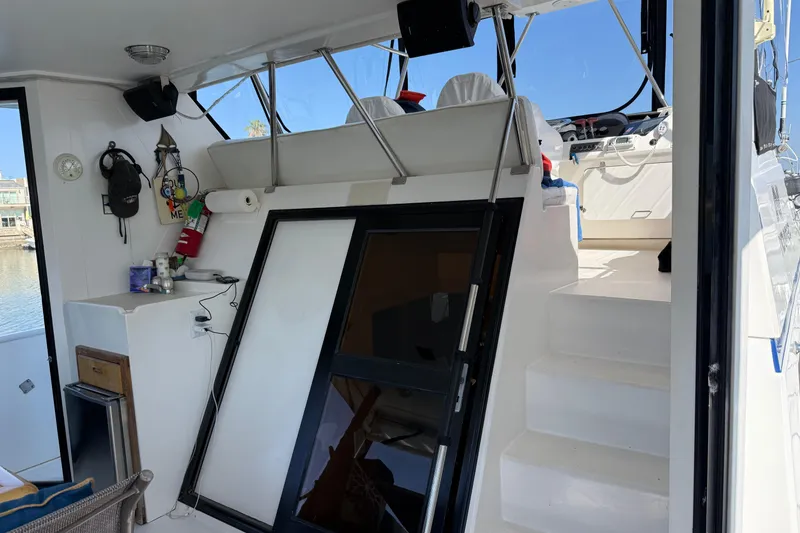 Slide: The Image of Interior view of a 1993 Novatec 44 boat, featuring stairs and nautical equipment. - 4