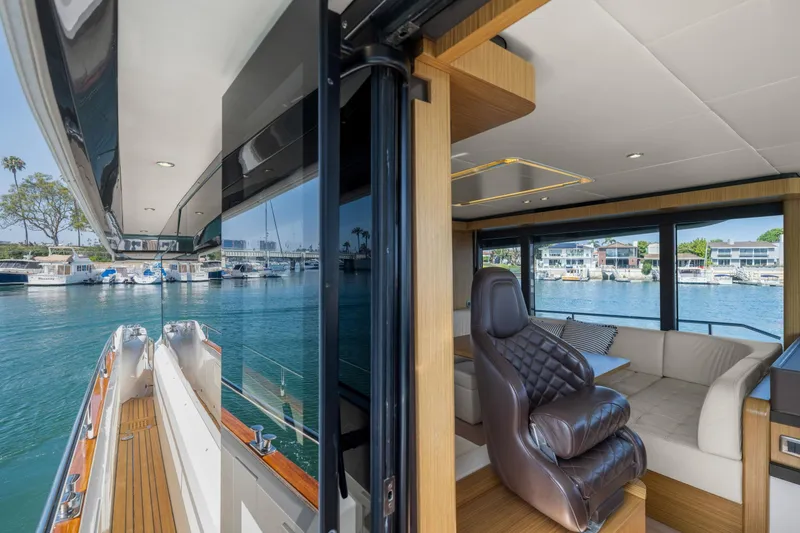 Slide: The Image of Luxurious interior of 2018 Absolute Navetta 52 yacht with waterfront view. - 11