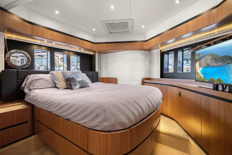 Slide: The Image of Luxurious bedroom interior of 2018 Absolute Navetta 52 yacht with modern wood finishes. - 13
