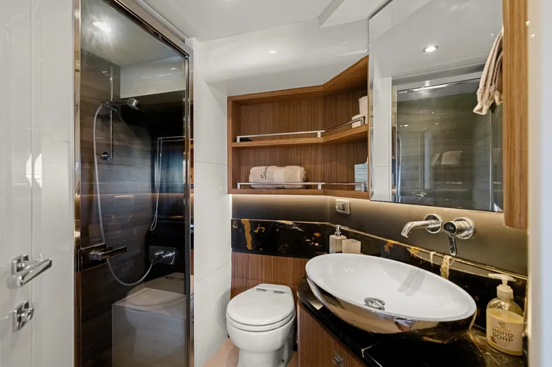 Slide: The Image of Luxurious bathroom on 2018 Absolute Navetta 52 yacht, featuring modern fixtures and elegant design. - 19