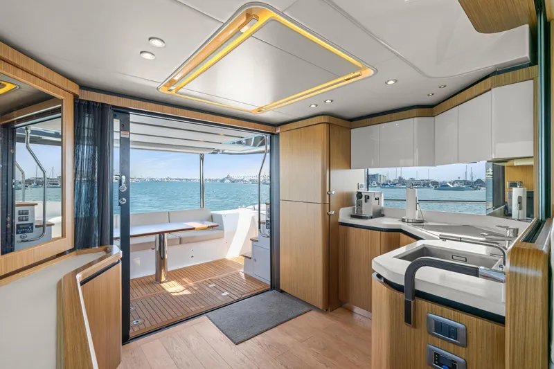 Slide: The Image of Luxurious interior of 2018 Absolute Navetta 52 yacht with modern kitchen and ocean view. - 2