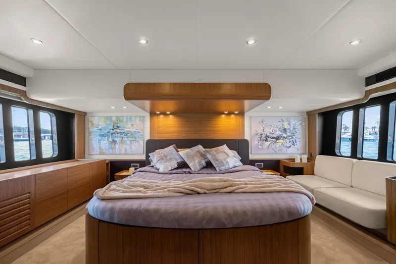 Slide: The Image of Luxurious 2018 Absolute Navetta 52 yacht bedroom with elegant decor and panoramic windows. - 21