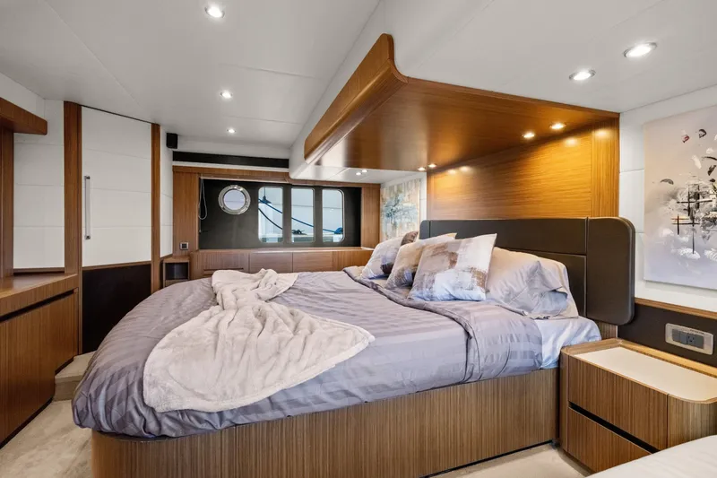 Slide: The Image of Luxurious bedroom interior of 2018 Absolute Navetta 52 yacht with modern design and cozy bedding. - 23