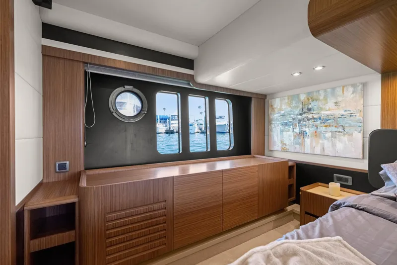 Slide: The Image of Luxurious interior of 2018 Absolute Navetta 52 yacht with modern wood finishes and ocean view. - 24