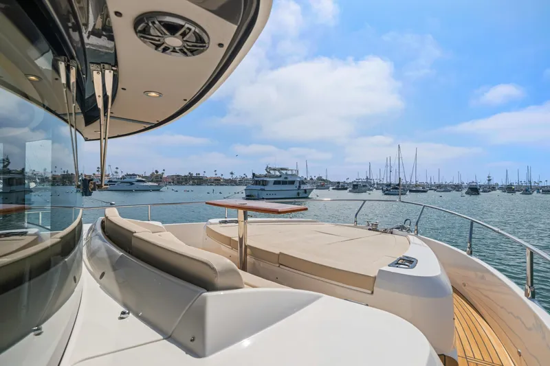 Slide: The Image of Luxurious 2018 Absolute Navetta 52 yacht with spacious deck, docked in a scenic marina. - 29
