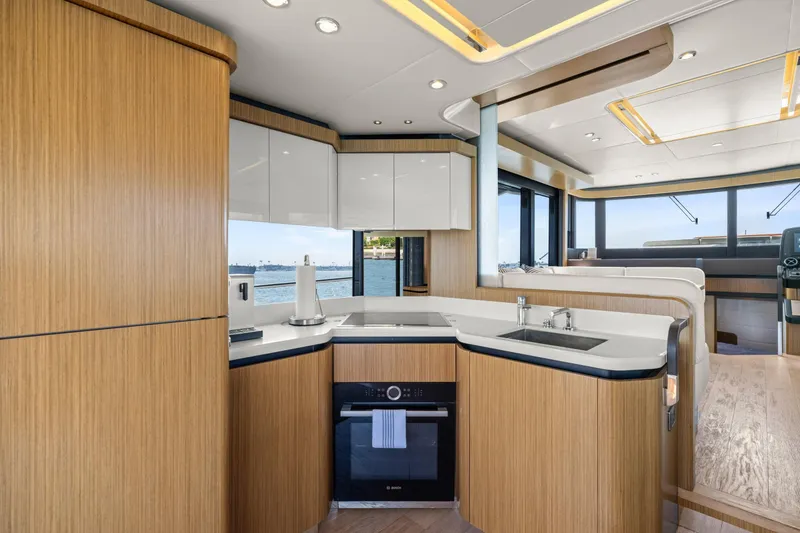 Slide: The Image of Luxurious interior of 2018 Absolute Navetta 52 yacht with modern kitchen design. - 4