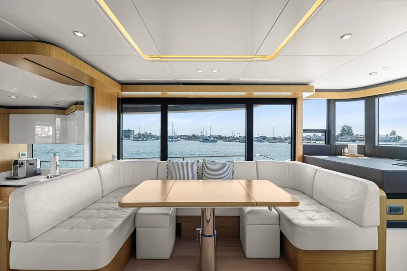 Slide: The Image of Luxurious interior of 2018 Absolute Navetta 52 yacht with panoramic windows and elegant seating. - 6