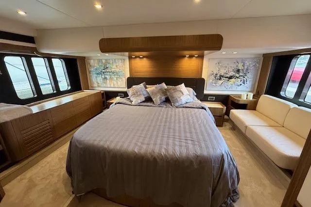 Slide: The Image of Luxurious bedroom interior of 2018 Absolute Navetta 52 yacht with modern decor and large windows. - 12