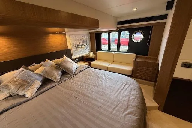 Slide: The Image of Luxurious bedroom interior of 2018 Absolute Navetta 52 yacht with elegant decor and cozy seating. - 13