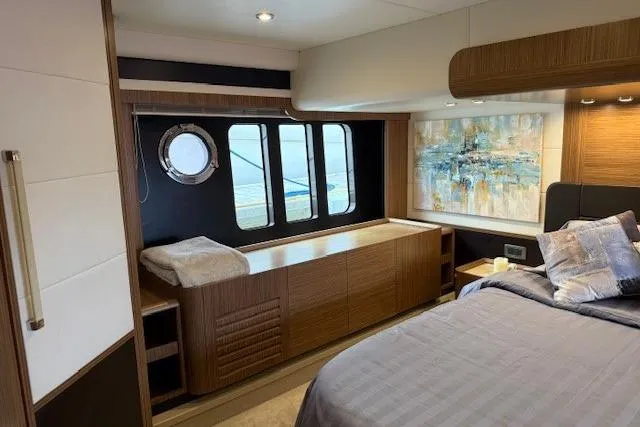 Slide: The Image of Luxurious interior of 2018 Absolute Navetta 52 yacht with modern decor and large windows. - 14
