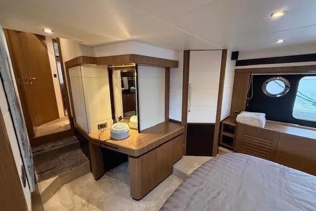 Slide: The Image of Luxurious interior of 2018 Absolute Navetta 52 yacht with elegant wood finishes and modern design. - 16