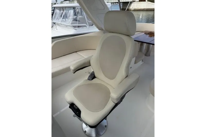 Slide: The Image of Luxurious captain's chair on 2018 Absolute Navetta 52 yacht, featuring beige upholstery. - 22