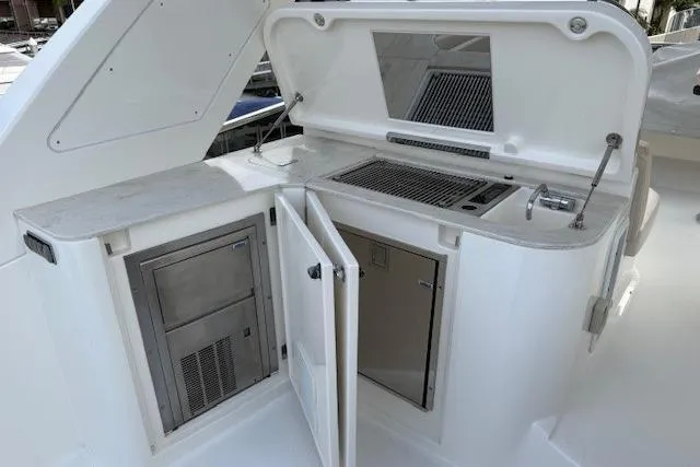 Slide: The Image of Outdoor kitchen on 2018 Absolute Navetta 52 yacht with grill and storage cabinets. - 23