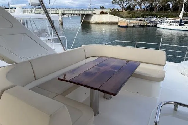 Slide: The Image of Luxurious seating area on 2018 Absolute Navetta 52 yacht, docked near marina. - 27