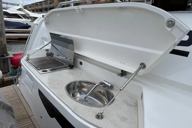 Slide: The Image of Outdoor kitchen on 2018 Absolute Navetta 52 yacht with sink and grill. - 29