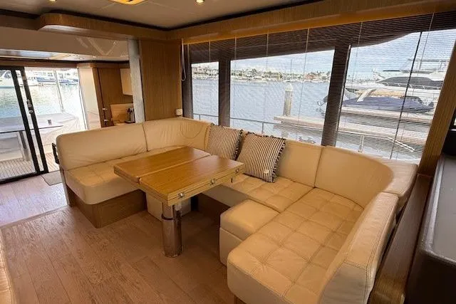 Slide: The Image of Luxurious interior of 2018 Absolute Navetta 52 yacht with plush seating and wooden table. - 3